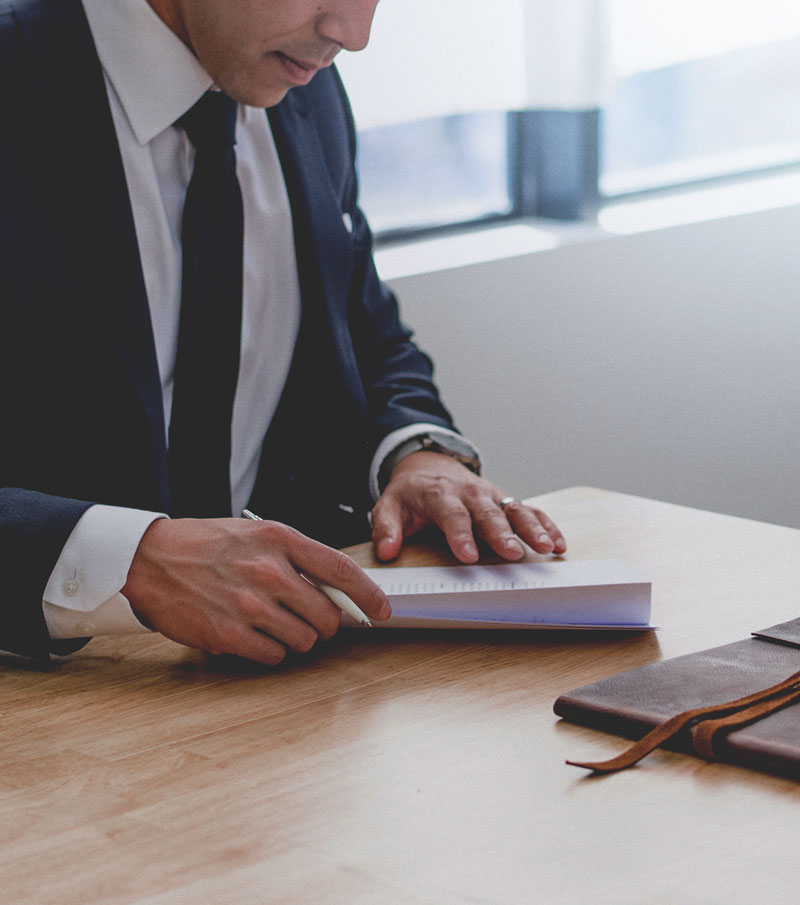 lawyer writing on desk